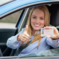 woman in car happy to get driving license