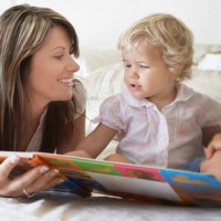 babysitter with two kids reading a book on the bed find a job