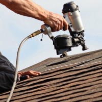 roofing contractor repairing a roof leak